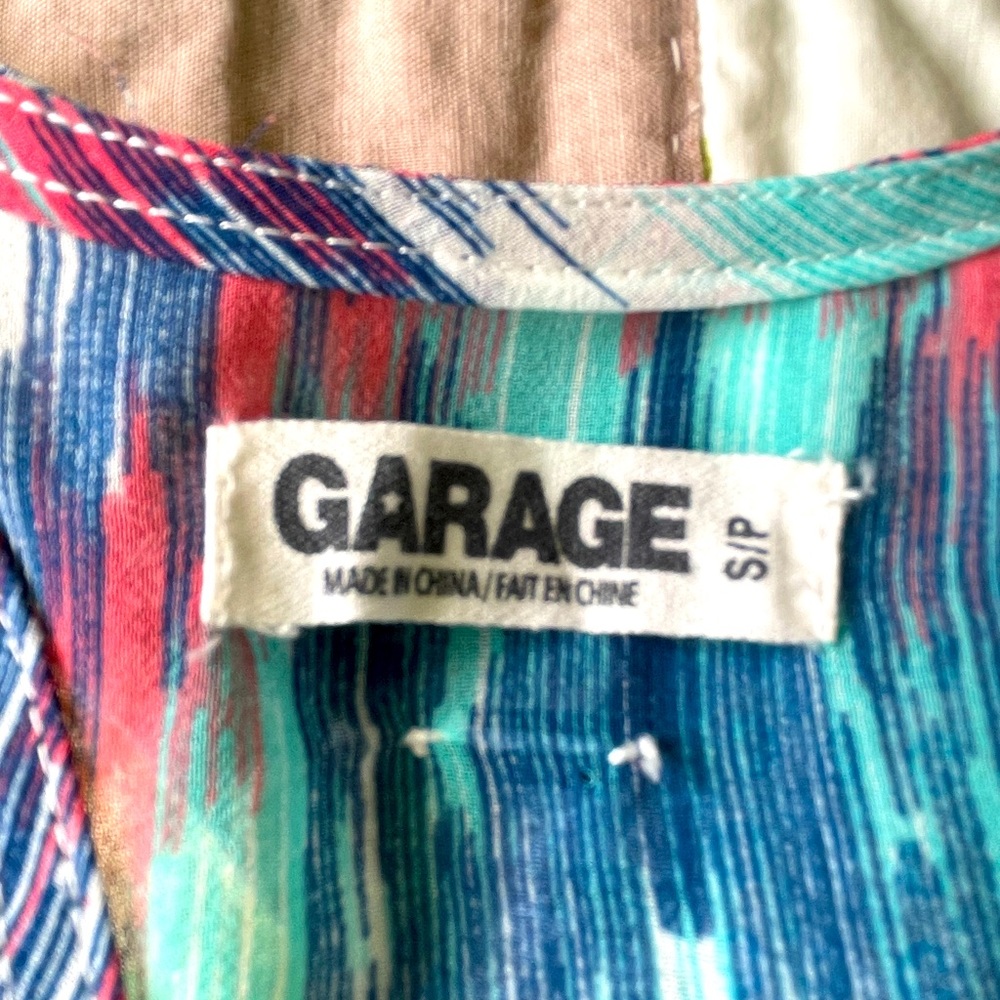 Garage 100 percent polyester tank top.